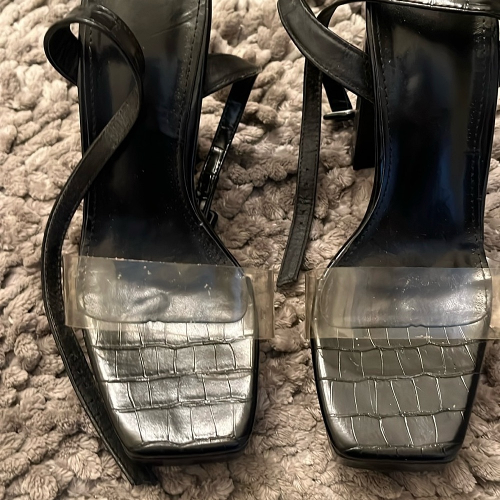 Black platform, snakeskin like texture, with pvc clear strap. Size 37
